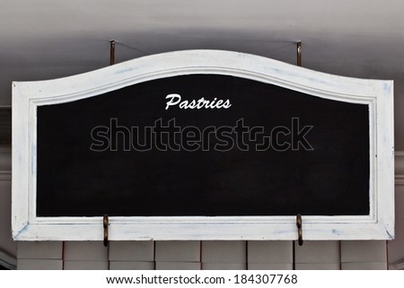 Black horizontal blank chalkboard with white vintage wooden frame including clipping path