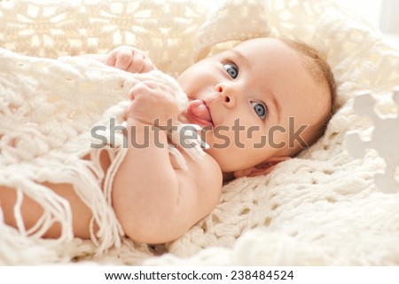 Similar – Foto Bild Kleines Baby in Blau liegt auf einem Bett