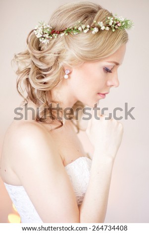 Tender beauty portrait of bride with flowers wreath in hair
