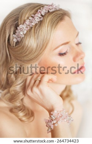 Tender beauty portrait of bride with accessories wreath in hair