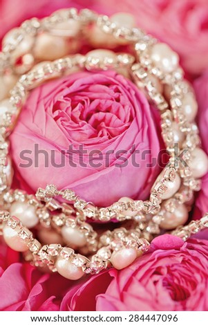 Wedding accessories to hairstyle on tenderness rose background. Hand made hair-pin.