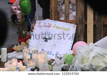 NEWTOWN, CT., USA, DEC 16, 2012: Sandy Hook Elementary School shooting, Memorial sign with assorted gifts, Dec 16, 2012 in Newtown, CT., USA