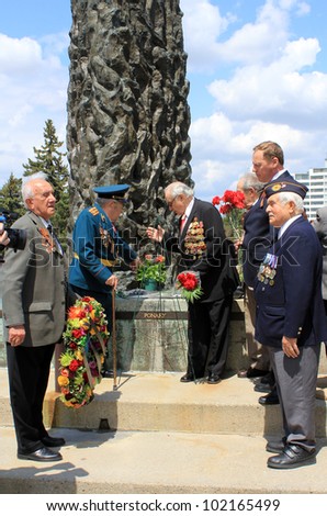 TORONTO  MAY 09: The group of veterans place on the wreath to the monument at annual meeting of veterans of 2-nd World War in May 09 2012 in Toronto, Canada.