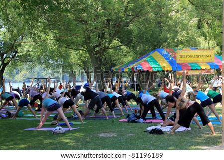TORONTO – JULY 17:  Yoga at 39th Annual festival of India in July 17 2011 on Central Island in Toronto, Canada. The festival is a popular annual tourist attraction  for the last 39 years.