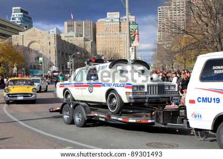 TORONTO, CANADA – NOVEMBER 20: Vintage police car at Christmas Parade  November 20, 2011 in Toronto Downtown, Canada