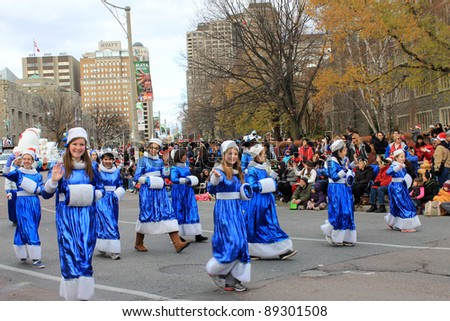 TORONTO, CANADA – NOVEMBER 20: Girls students  take part in Christmas Parade  November 20, 2011 in Toronto Downtown, Canada