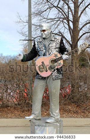 RICHMOND HILL – FEBRUARY 05: The guitarist in costume of Elvis Presley at Winter Carnival in Mill Pond Park in Richmond Hill, Canada in February 05, 2012.