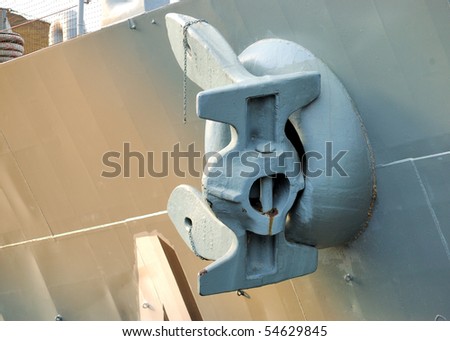 An anchor on the side of a naval battleship.