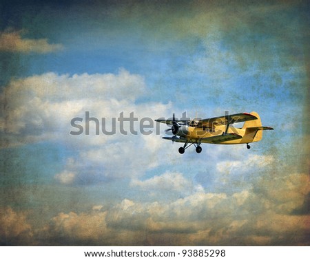Old flying biplane, retro aviation background