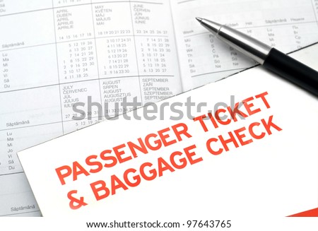 Plane passenger ticket and baggage check on diary planner