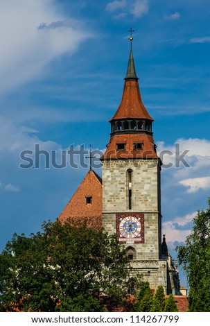 Black Church clocktower in Brasov, Romania. This is the largest gothic church in Eastern Europe