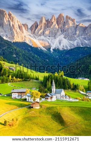 Val di Funes, Italy - Beautiful Santa Maddalena village with idyllic Dolomites mountains in Funes valley, South Tyrol, Italian Alps at autumn sunset. Stok fotoğraf © 
