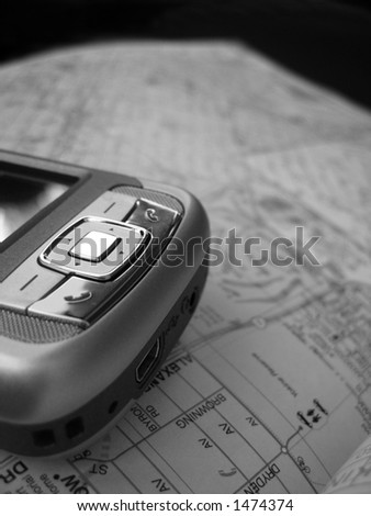 A Smartphone PDA with GPS capability. The background is a street map. This is a black and white image.