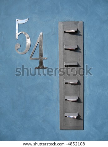 Apartment mail slots. The address is number 54.