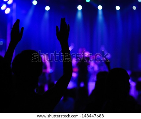 concert, happy people silhouettes, raise up hands, disco party with large group of dancing man, bright stage lights, active lifestyle, music entertainment, nightclub, night life concept