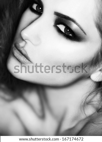 beauty fashion close-up Portrait of beautiful young woman with bright make-up. the black and white photo