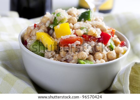 Close up of fresh quinoa salad with bell peppers and chickpeas.