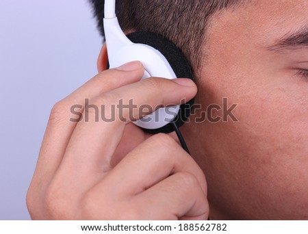 Asian man with a white earphone