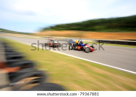A motion blur of racing car overtaking