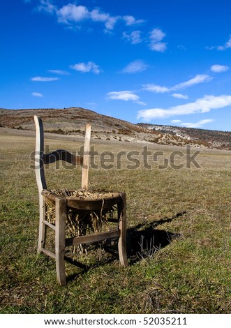 A lonely chair abandoned in the country