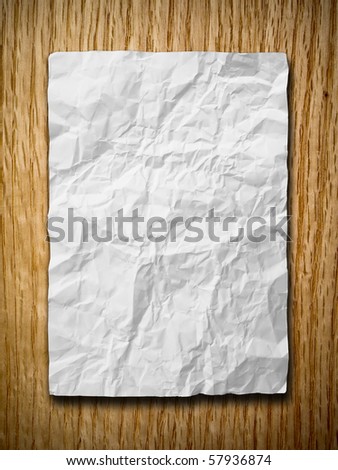 White crumpled paper on red oak wood with shadow