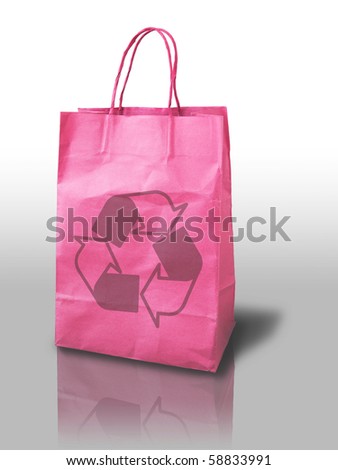 pink recycle shopping paper bag on reflect floor