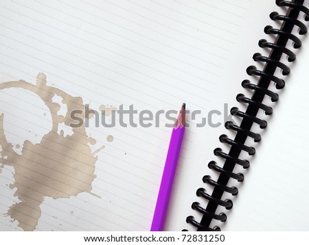 Purple pencil on white note book and Coffee stains