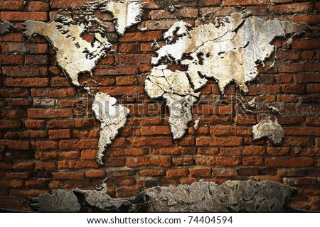 Grunge concrete world map on old brick wall