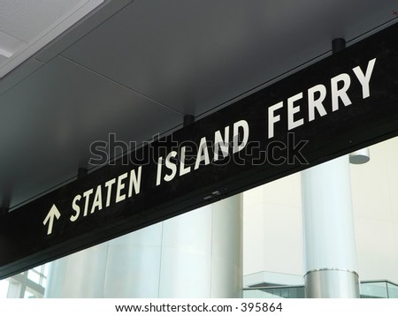 A sign directs riders to the Staten Island Ferry loading dock in the newly built terminal in Manhattan, New York City.