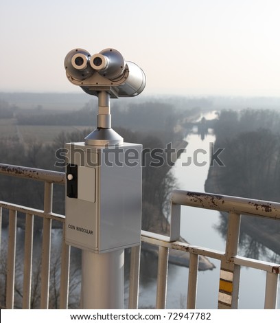Coin operated telescope looking out Canal Vltava - Labe in Melnik, Czech Republic