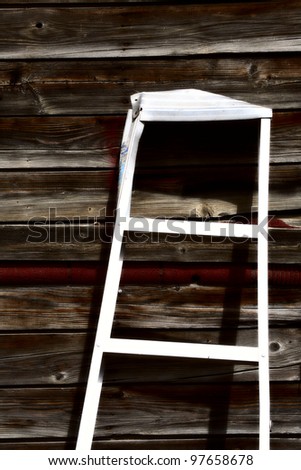 Aluminum ladder against old garage in Saskatchewan
