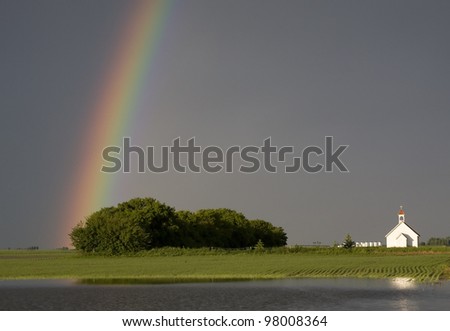 Country Church and Rainbow after storm Canada