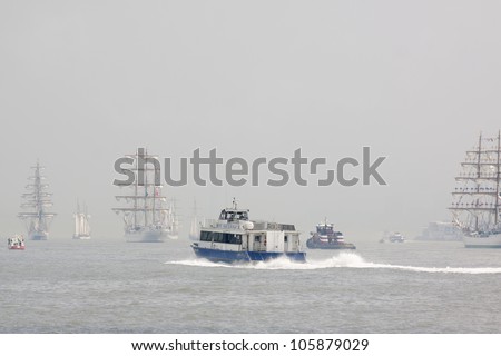 HOBOKEN, NJ - MAY 23: A NY Waterway ferry boat moves up the Hudson River near Manhattan during the Parade of Sails on May 23, 2012 in Hoboken, NJ. The parade marks the start of Fleet Week.