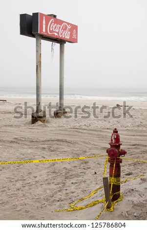SEASIDE HEIGHTS, NJ - JAN 13:The boardwalk Coca Cola sign in the fog on January 13, 2013 in Seaside Heights, New Jersey. Clean up continues 75 days after Hurricane Sandy hit the shore in October 2012.