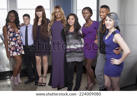 NEW YORK - OCT 16, 2014: Laverne Cox, actress in \'Orange Is The New Black\' and cast members from her documentary \'The T Word\' on the observation deck of the Empire State Building.
