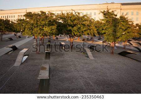 ARLINGTON, VA - SEPT 13, 2014: Lines of granite and stainless steel memorial units facing the Pentagon. The cantilevered benches have pools of water and name of each victim of the 2001 attack.