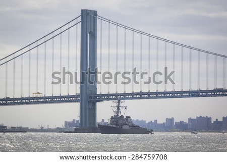 STATEN ISLAND, NY - MAY 20 2015: USS Stout (DDG 55) passes under the Verrazano-Narrows Bridge on the Upper Bay during the Parade of Ships, which begins Fleet Week.