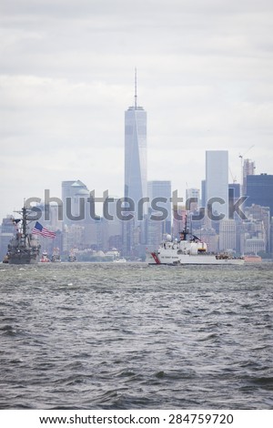 STATEN ISLAND, NY - MAY 20 2015: USCGC Spencer (WMEC 905) passes the Freedom Tower of One World Trade Center in Lower Manhattan on the Hudson River during the Parade of Ships which begins Fleet Week.
