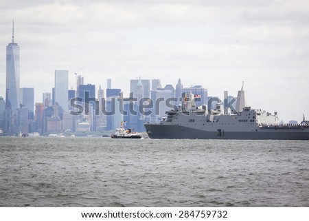 STATEN ISLAND, NY - MAY 20 2015: USS San Antonio (LPD 17) on the Hudson River near the Freedom Tower of One World Trade Center in Lower Manhattan during the Parade of Ships, which begins Fleet Week.
