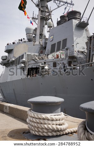 STATEN ISLAND, NY - MAY 20 2015: Low angle view of the guided-missile destroyer USS Barry (DDG 52) moored during Fleet Week NY at Sullivans Pier.
