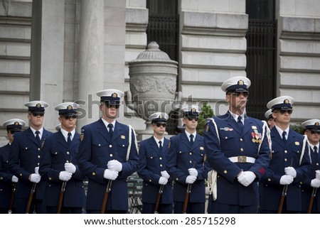 NEW YORK - MAY 21 2015: The US Coast Guard Ceremonial Honor Guard Silent Drill Team perform next to the New York Public Library in Bryant Park during Fleet Week NY 2015.