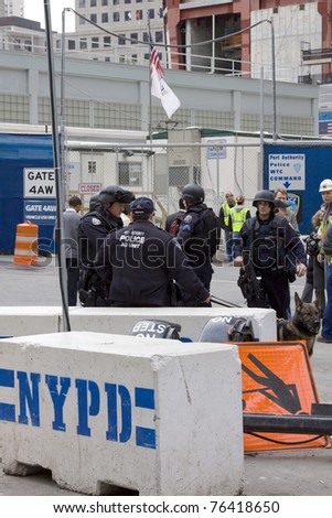 NEW YORK - MAY 2: Port Authority Police stand guard near the World Trade Center PATH train station on May 2, 2011 in New York City. Osama bin Laden was killed in Pakistan by US Seals the day before.