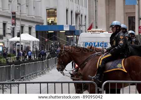NEW YORK - NOV 17: Police on horseback temporarily at Broad Street and Exchange Place near the entrance to the NY Stock Exchange on the \'Day of Disruption\' on November 17, 2011 in New York City, NY.
