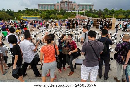 PUTRAJAYA, MALAYSIA - DEC 23, 2014: Family and friends visiting the 1600 Pandas campaign organised by WWF - Malaysia. This is to pass on the important message of environmental preservation.