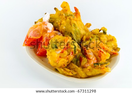 Delicious prawn fritters snack with packs of chili sauce isolated on white. Concept of asian snack.
