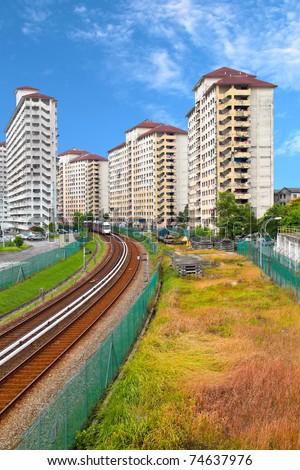Railway track passing through housing area. Concept of urban transportation and noise pollution.
