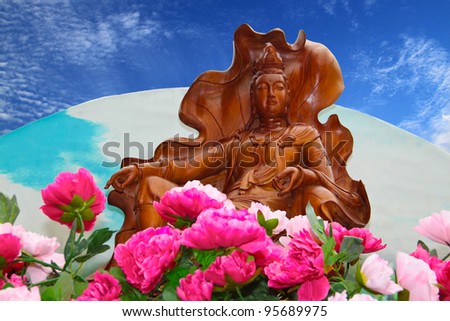 Wooden buddha statue on procession. Concept of religious celebration.