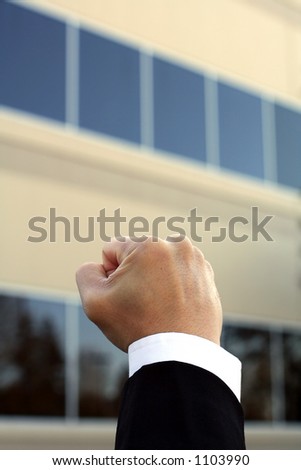 Fist of a businessman, showing happiness and excitement