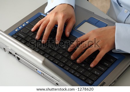 Businesswoman hands on laptop