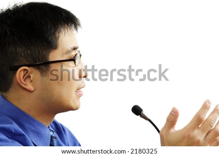 A businessman giving a speech (isolated white)